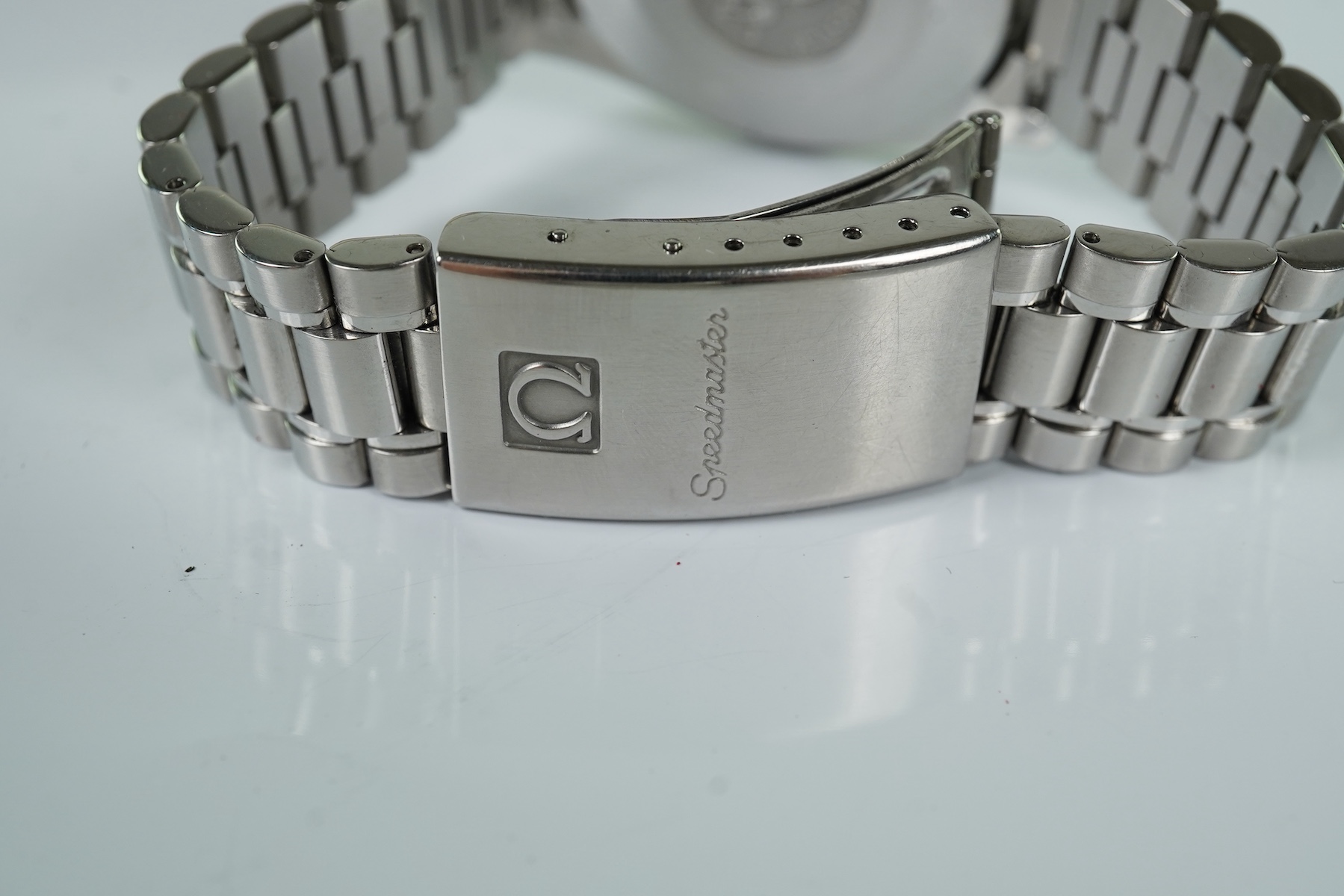 A gentleman's late 1990's stainless steel Omega Speedmaster automatic wrist watch, with box and three pamphlets